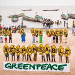 Greenpeace Africa activists, together with Joal villagers and local fishermen express their commitment to sustainable fishing after the departure of foreign pelagic trawlers. 