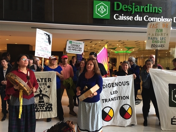 People demonstrate outside Desjardins, North America’Jacques Lebleu & Guillaume Durin