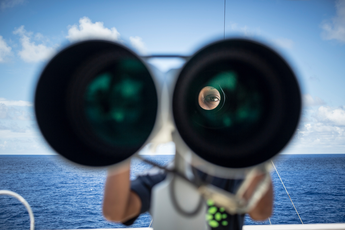 Crew member on the lookout for FADs © Will Rose / Greenpeace