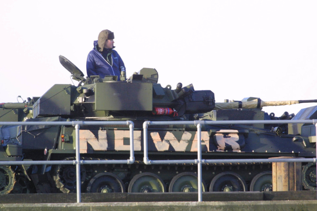 Activists on a military tank in the UK, 2003 © David Sims / Greenpeace