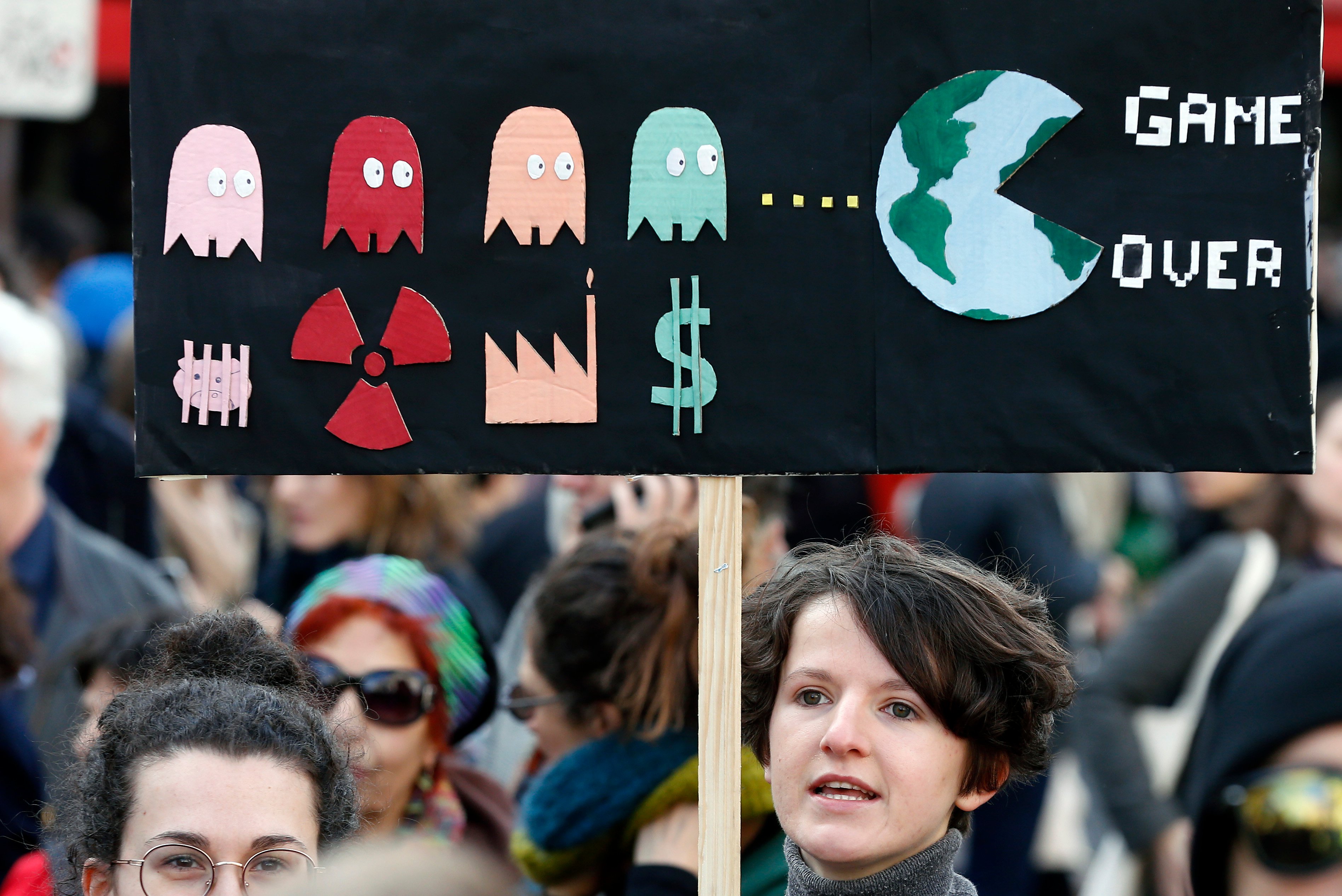 PARIS, FRANCE - MARCH 16: A protester holds a sign reading "Game over" as he takes part in the "March of The Century" (La Marche du Siecle) to demand answers to climate change on March 16, 2019 in Paris, France. Several thousand people demonstrated in Paris to denounce the government's inaction on climate. Chesnot/Getty Images