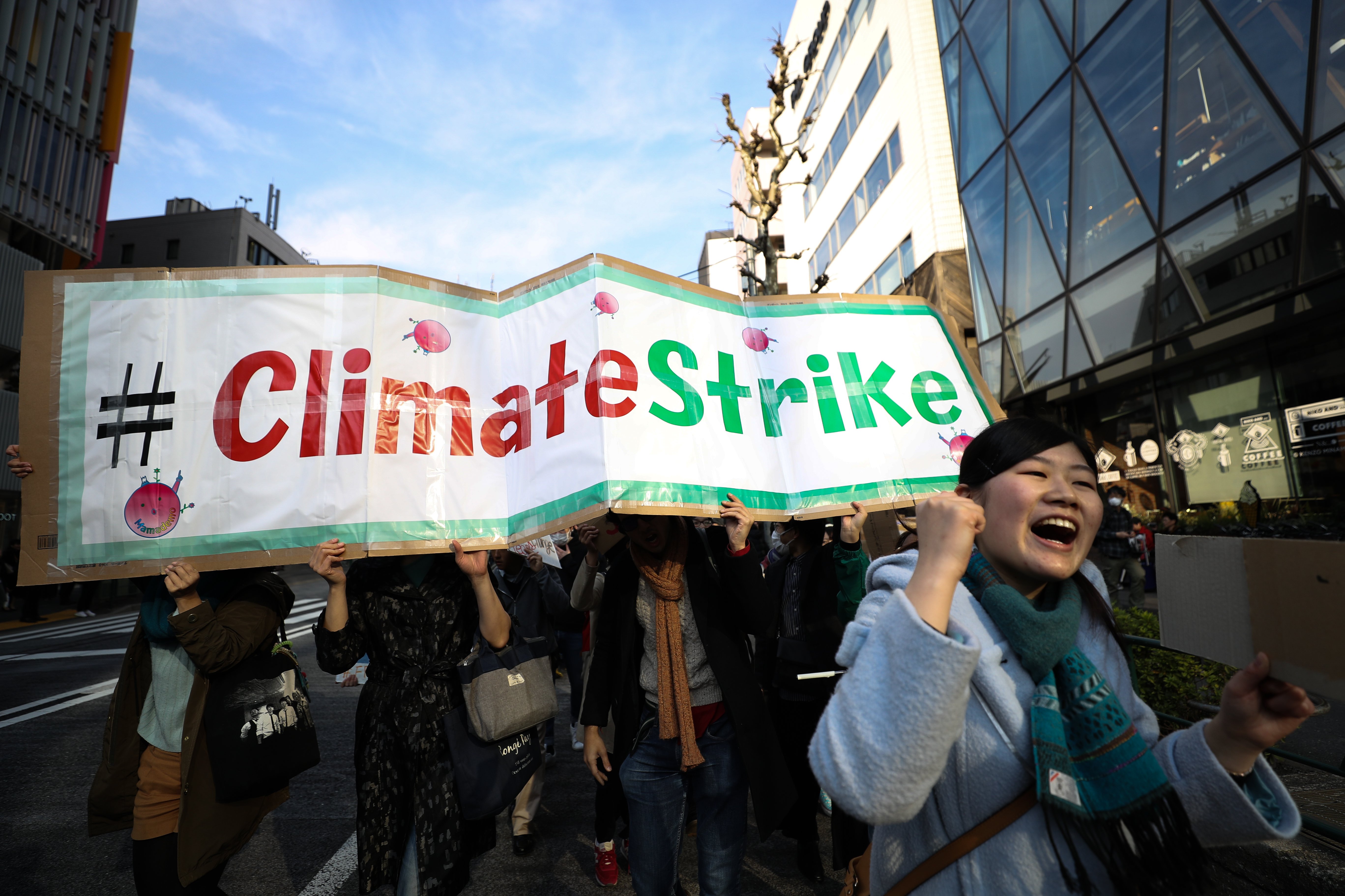 TOKYO, JAPAN - MARCH 15: Participants hold signs and shout slogans during the Fridays for Future march on March 15, 2019 in Tokyo, Japan. Students around the world took to the streets on March 15 to protest a lack of climate awareness and demand that elected officials take action on climate change. Inspired by Greta Thunberg, the 16-year-old environmental activist who started skipping school since August 2018 to protest outside Sweden's parliament, school and university students worldwide have followed her lead and shared her alarm and anger. Takashi Aoyama/Getty Images