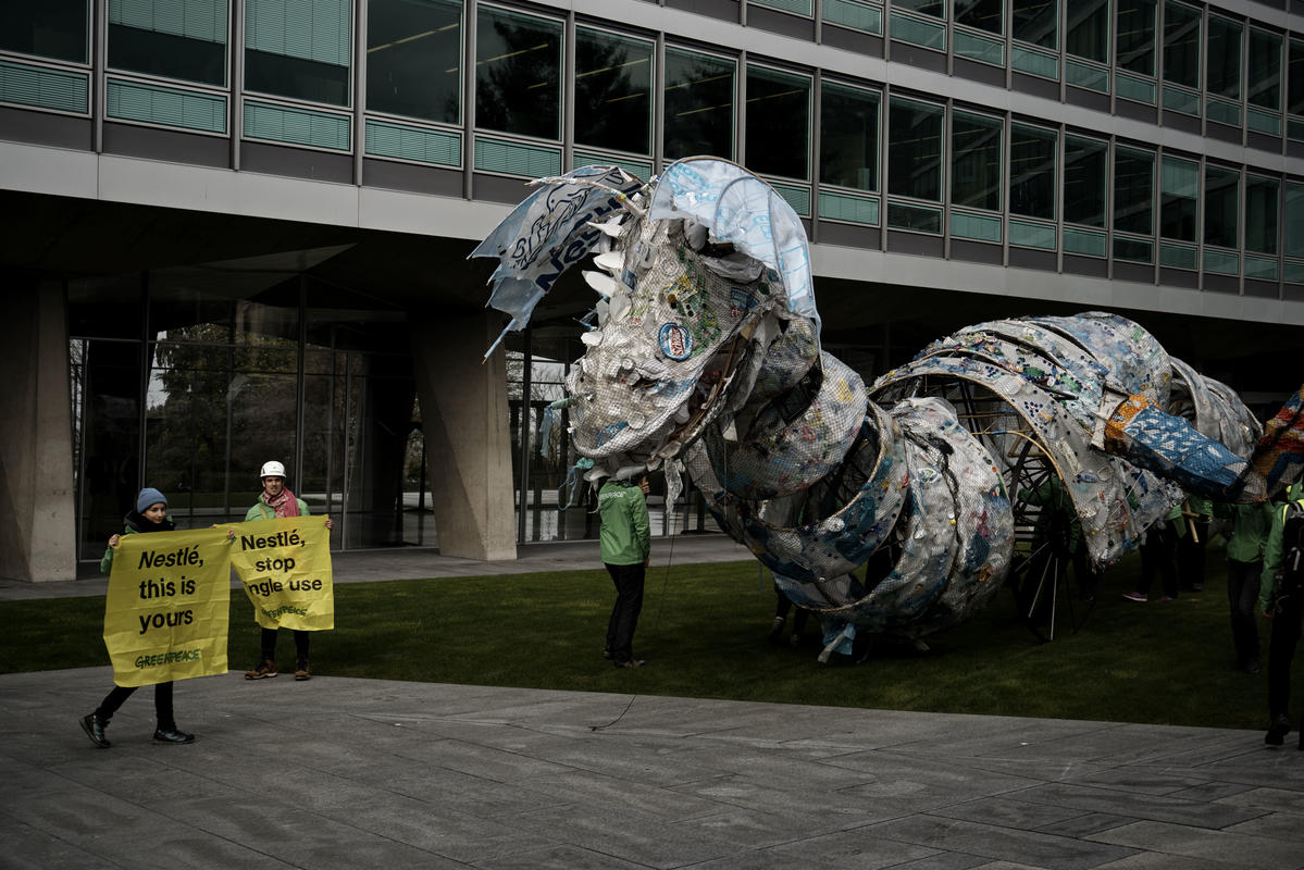 Plastic Monster Action at Nestlé Headquarters in Switzerland © Yukon Benner / Greenpeace