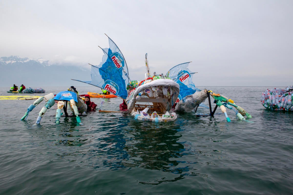 Plastic Monster Action at Nestlé Headquarters in Switzerland. © Greenpeace / Miriam Künzli