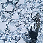 Aerial view of Greenpeace ship the Arctic Sunrise at the ice edge bringing scientists to take sea ice core samples, measure snow and ice thickness, and water column properties below the ice at the Arctic ice edge in Fram Strait, between Svalbard and Greenland. A group of US scientists is collecting data at the Arctic sea ice edge in May 2019 during the time of spring algae blooms to study the interactions between melting sea ice and the local ecosystem. &copy; Christian &Aring;slund / Greenpeace