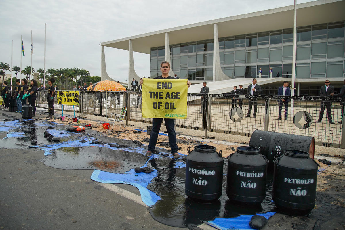Oil Spill and Burnt Forest Action in Brazil. © Christian Braga / Greenpeace