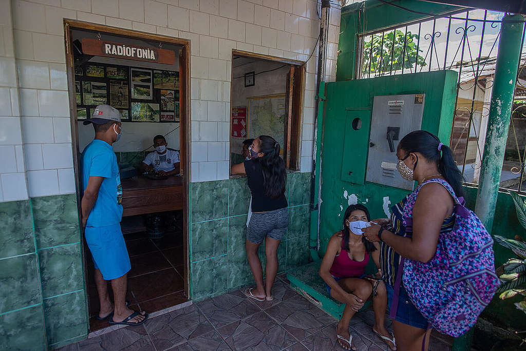 Youth from the Wayuri Indigenous Communication Network broadcasting information on COVID-19  for the Indigenous communities on the Rio Negro region. © Christian Braga / Greenpeace