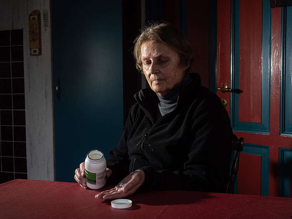 Woman Taking Medication in Home near Vandvaerksgaarden Factory Farm, Denmark. © Greenpeace / Wildlight / Selene Magnolia