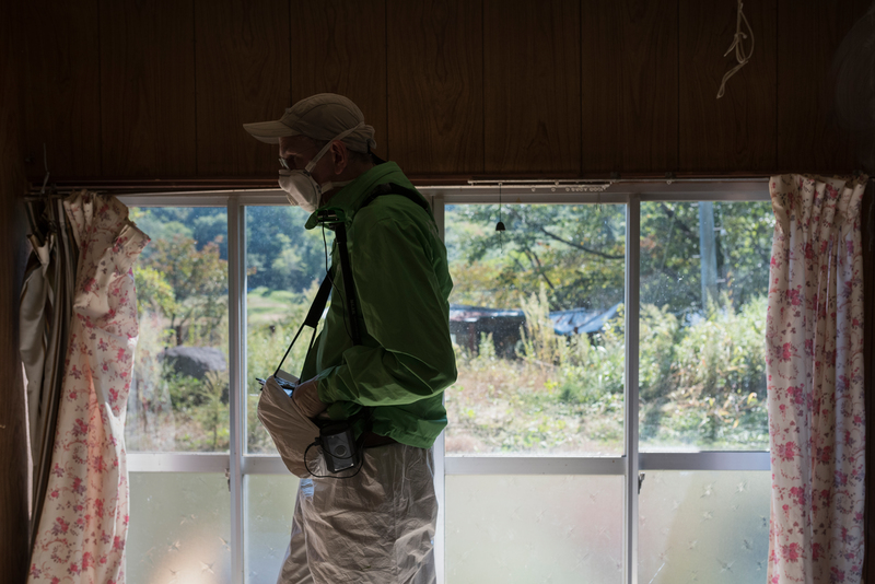 Greenpeace radiation specialist conducting survey of the home of evacuee Mr. Toru Anzai in Iitate, Fukushima prefecture, Japan.