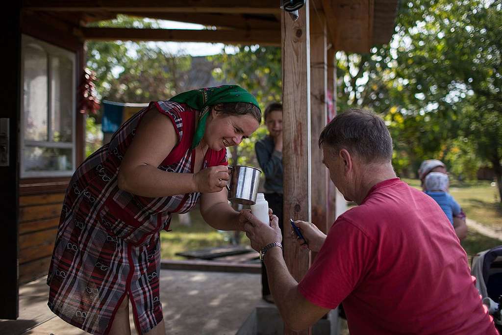 Taking Milk Samples in Ukraine. © Denis  Sinyakov / Greenpeace