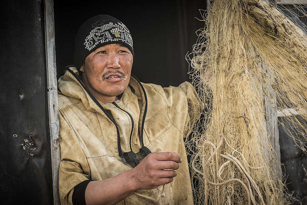 Fisherman in Russia. © Greenpeace / Dmitry Sharomov