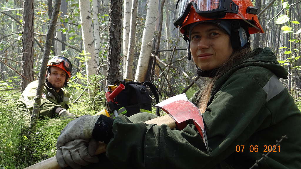 Volunteer frefighters trying to get some rest in the forest, Russia, July 2021.