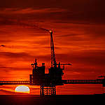 The sun sets behind Total's Culzean Platforms located in the Culzean Field. Culzean is a gas condensate field located in the British North Sea, 230 kilometres off the coast of Aberdeen.