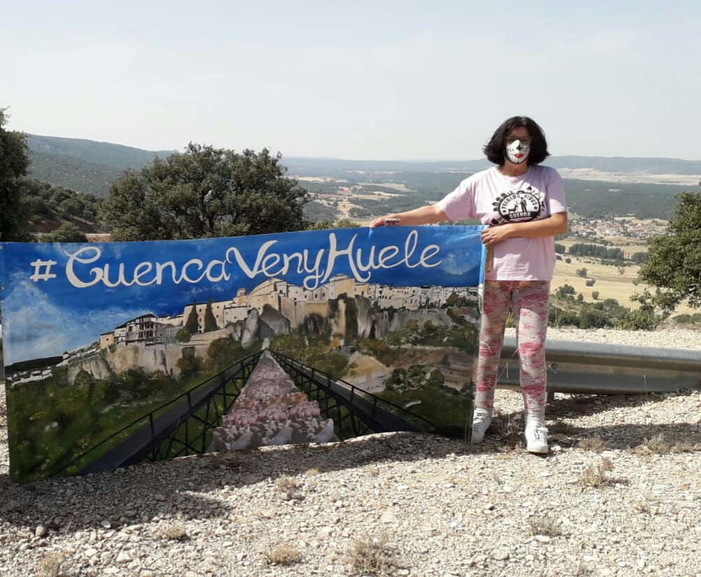 Remedios Bobillo Jimenez (Mota del Cuervo, Cuenca, Castilla la Mancha) stands with a banner protesting against the smell and pollution caused by a factory farm.