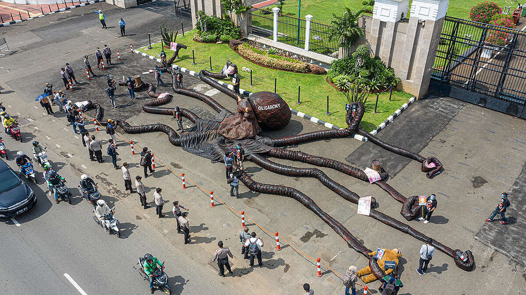 Greenpeace Indonesia activists install a giant "oligarchy monster" during an action at the parliament building in Jakarta. The octopus shaped monster is seen latching onto numerous dimensions and aspects of citizens’ lives: energy, agriculture, freedom of speech, the lives of indigenous peoples, as well as the weakening of the Corruption Eradication Commission (KPK).
