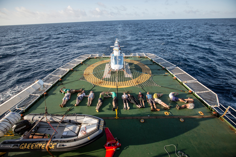 Crew members lie on the grouns in the shape of the letters T-H-A-N-K-S