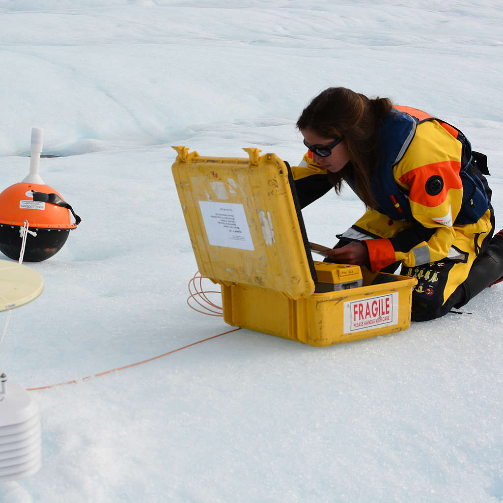 Woman scientist studying glacier