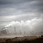 Smoke Billowing over Oil Plants. © Greenpeace / Colin O'Connor