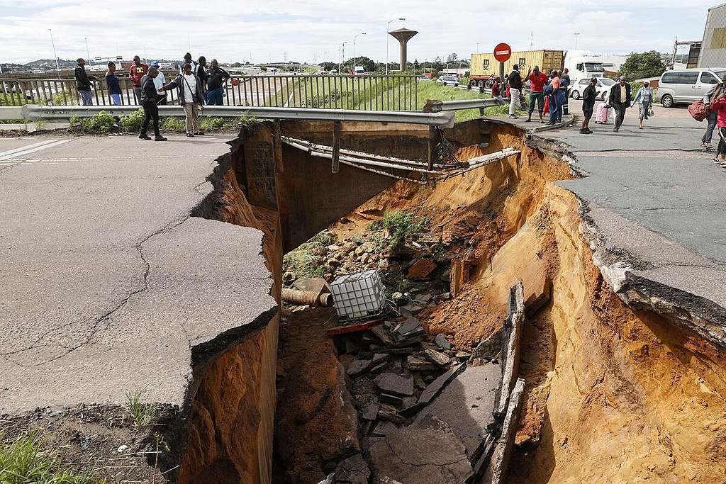 A crack in the road following heavy rains and winds in Durban, on April 12, 2022. - At least five people have been killed in floods and mudslides across South Africa's port city of Durban following heavy rains in recent days. Days of rains have flooded several areas and shut dozens of roads across the city © PHILL MAGAKOE / AFP via Getty Images