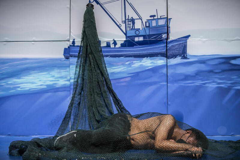 MERMAID CAUGHT IN A FISHING NET 