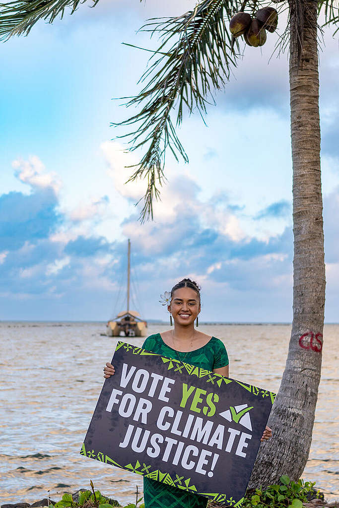 Activist in Fiji shows support for the Vanuatu government's move to seek advisory opinion at the International Court of Justice © The Roving Rovas / Greenpeace