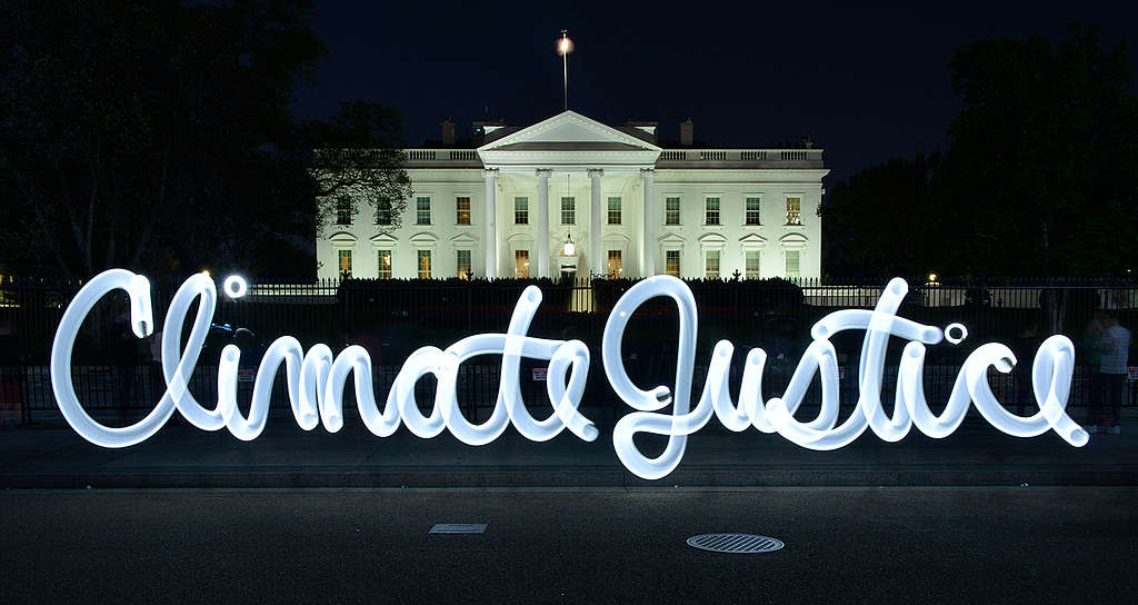 'Climate Justice' is displayed in lights at the White House in Washington DC, USA © Vicki DaSilva / Greenpeace