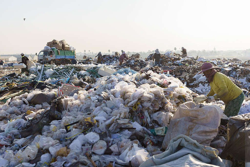 Waste pickers at a garment waste dump site, located on the outskirts of Phnom Penh.