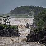 Raging waters flow along the Sendai River in the wake of Typhoon Nanmadol in Isa, Kagoshima prefecture on September 19, 2022. - Typhoon Nanmadol made landfall in southwestern Japan late on September 18, as authorities urged millions of people to take shelter from the powerful storm's high winds and torrential rain. YUICHI YAMAZAKI/AFP via Getty Images