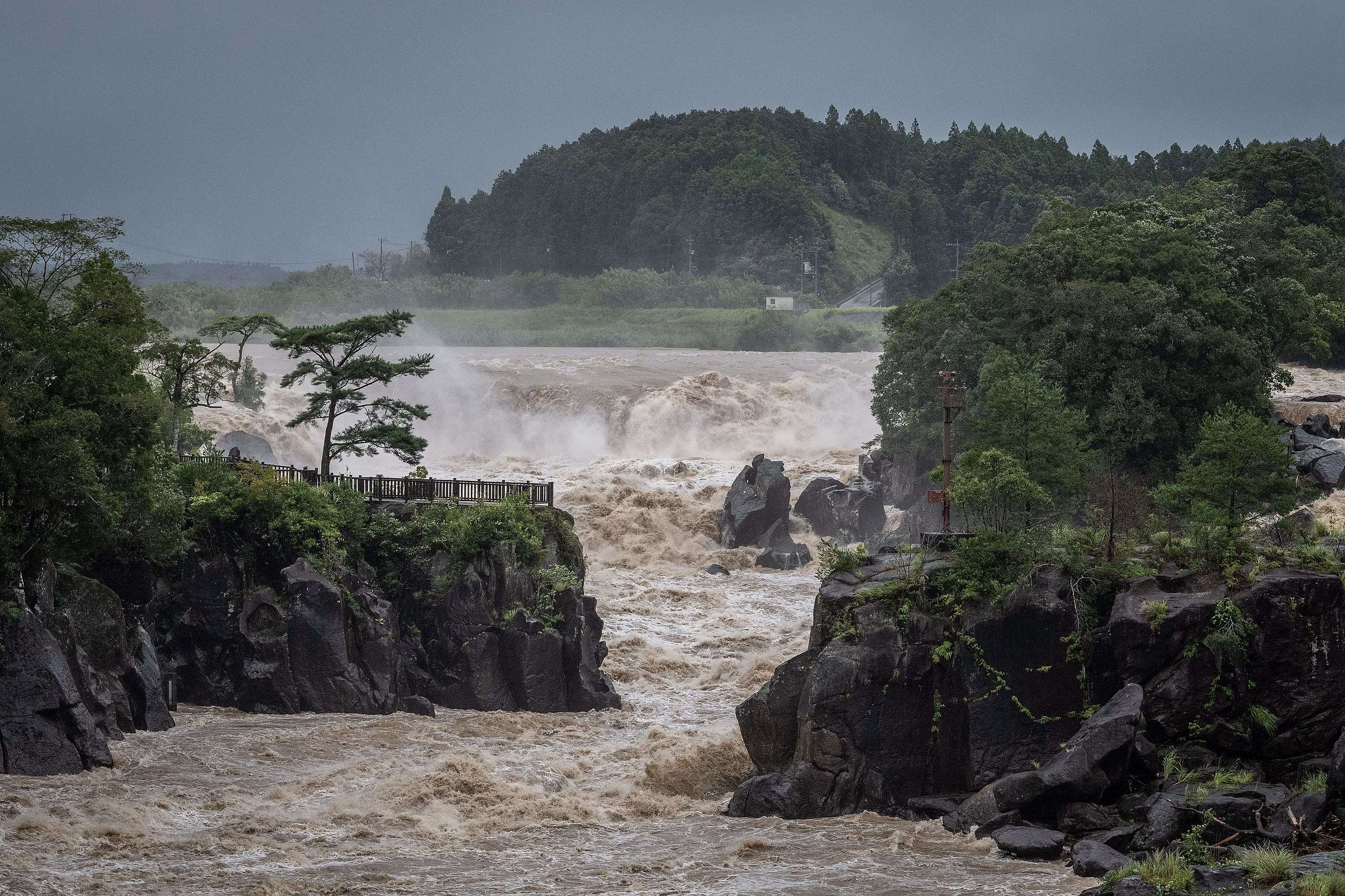 Raging waters flow along the Sendai River in the wake of Typhoon Nanmadol in Isa, Kagoshima prefecture on September 19, 2022. - Typhoon Nanmadol made landfall in southwestern Japan late on September 18, as authorities urged millions of people to take shelter from the powerful storm's high winds and torrential rain. YUICHI YAMAZAKI/AFP via Getty Images