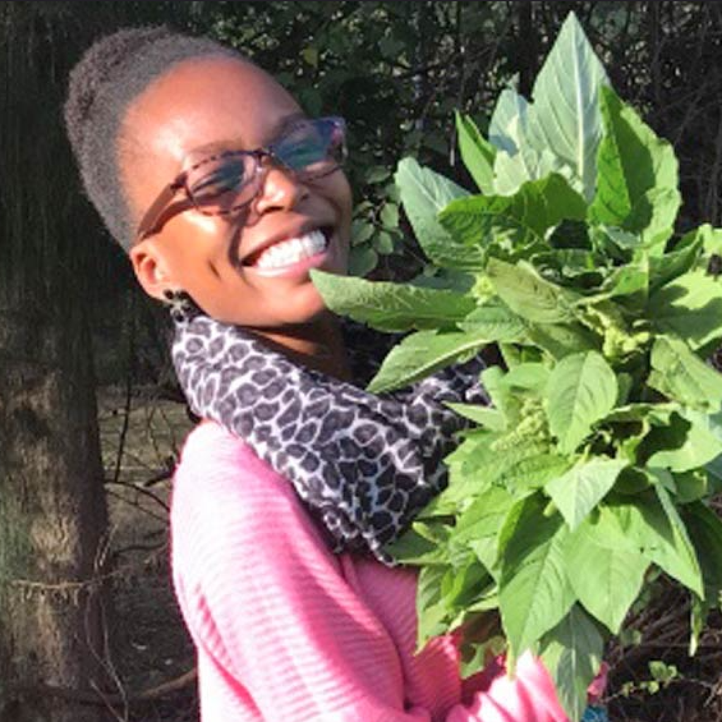 Claire Nasike Akello with plant
