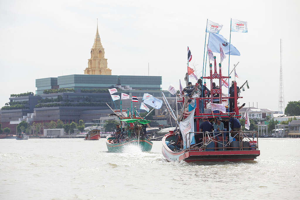 World Oceans Day 2022 in Thailand. Small fishing boats against the backdrop of the Thai Parliament