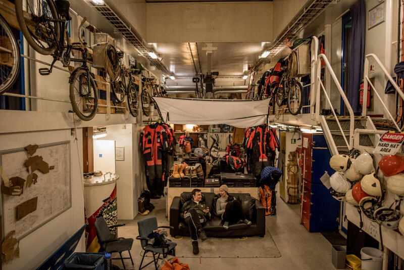 Crew inside the hold of Arctic Sunrise in Antarctica. © Tomás Munita / Greenpeace