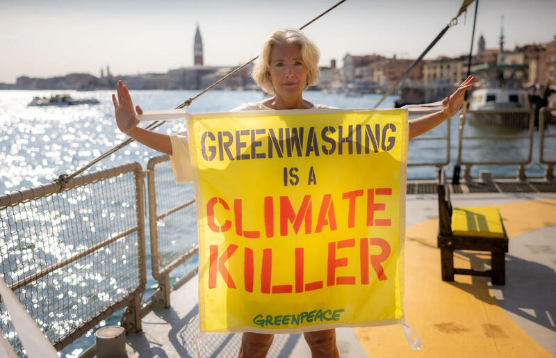 Emma Thompson on board the Greenpeace Rainbow Warrior in Venice supports the European Citizens' Initiative (ECI) to ban fossil fuel advertisements and sponsorships in the European Union holding a banner against greenwashing. If the petition collects one million signatures in a year, the European Commission is obliged to respond to the proposal. © Greenpeace / Lorenzo Moscia