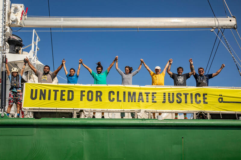 Crew from the Rainbow Warrior pose for the United for Climate Justice campaign, in the Mediterranean Sea near Egypt. © Andrew McConnell / Greenpeace © Andrew McConnell / Greenpeace