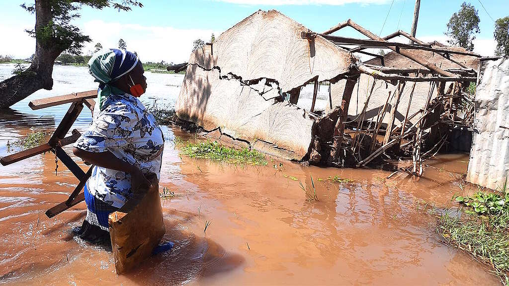 Woman near her house, destroyed by the floods. Floods are back in Kenya and households have been displaced over the last several days. The floods have left thousands displaced, hundreds lives lost, crops have been destroyed and livestock dead. Weather patterns in East Africa have been significantly affected by the changing global climate. Extreme weather events of floods and droughts are becoming more frequent and more intense as the climate crisis deepens. With the current COVID-19 crisis and locusts invasion, flooding will exacerbate the food security situation in the country.