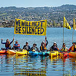 Rally against corporations trying to sue critics into silence in Oakland.