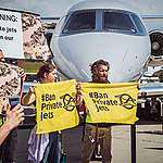 A hundred climate activists block private jets at biggest business aviation sales event in Europe, protesting luxury mega-polluters