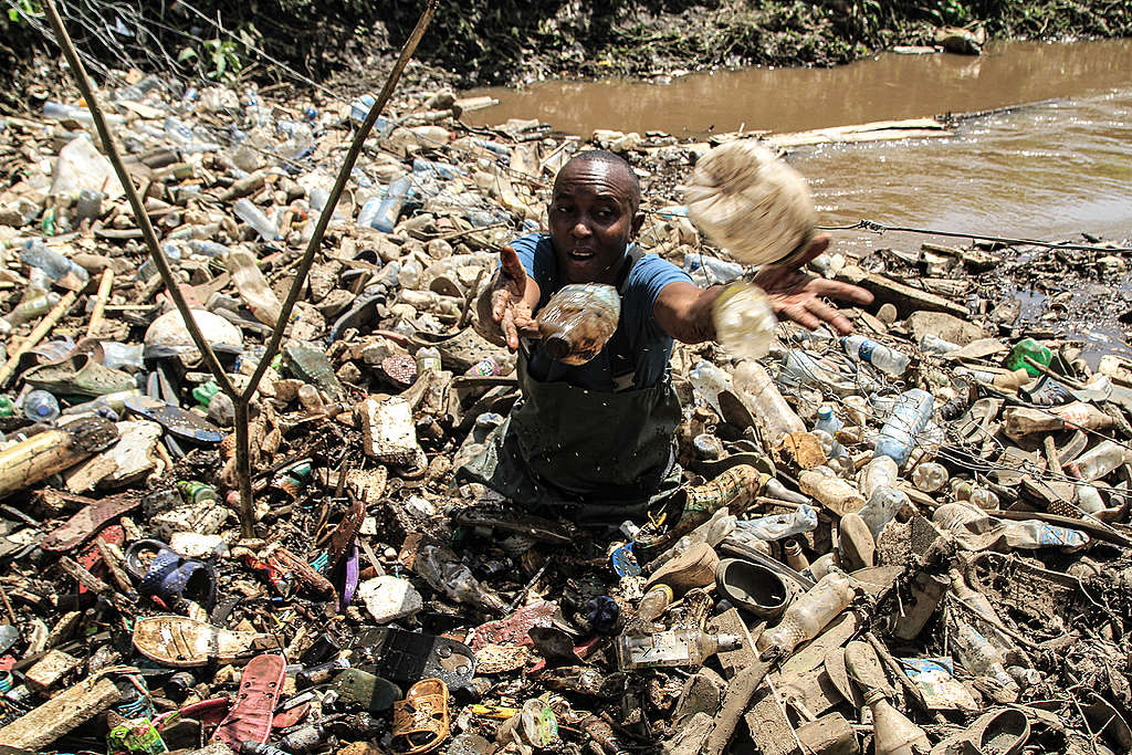 James collecting plastic waste at Njoro river James collecting plastic waste at Njoro River In Nakuru.