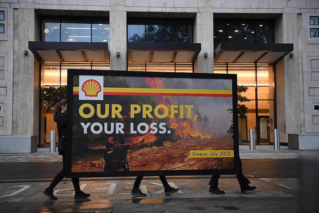 Greenpeace protesters erect a giant spoof billboard outside Shell’s HQ accusing them of fueling climate change and therefore complicity in last week’s devastating wildfires in Southern Europe as the company announced billions in profits from the last three months. The billboard, which features an image of a Greek firefighter battling to contain a wildfire near Athens last week, is emblazoned with Shell’s logo and features the slogan “Our profit, your loss”, drawing attention to the oil and gas industry’s responsibility for the climate crisis- fueled extreme weather that people are now experiencing across the world at unprecedented rates.
Greenpeace is demanding that Shell, and other oil companies alike, be made to stop drilling for more fossil fuels, and start paying for the devastation that they have caused.