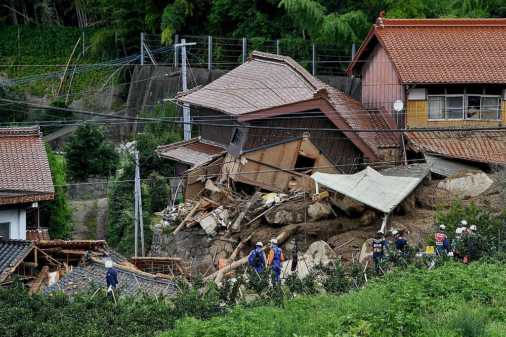 Rescue teams gather at the site of a landslide in Karatsu City, Saga prefecture on July 11, 2023, a day after heavy rains hit wide areas of Kyushu island. At least two people were killed in torrential rain in southwest Japan, as tens of thousands of residents were told to evacuate their homes. © KAZUHIRO NOGI/AFP via Getty Images