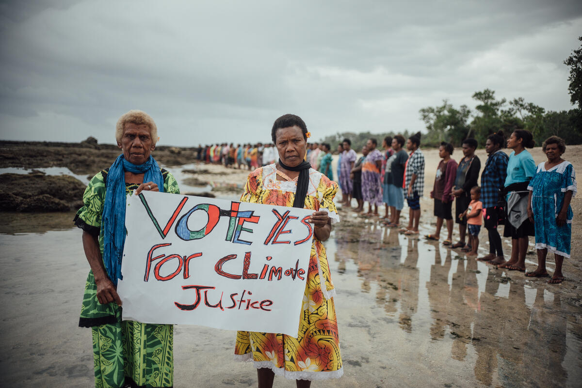 Vote Yes for Climate Justice Sign at ICJ AO Action in Tanna, Vanuatu. © Steven Lilo / Greenpeace