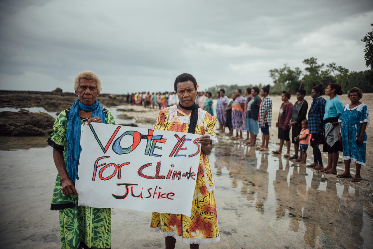Vote Yes for Climate Justice Sign at ICJ AO Action in Tanna, Vanuatu. © Steven Lilo / Greenpeace Vote Yes for Climate Justice Sign at ICJ AO Action in Tanna, Vanuatu. © Steven Lilo / Greenpeace