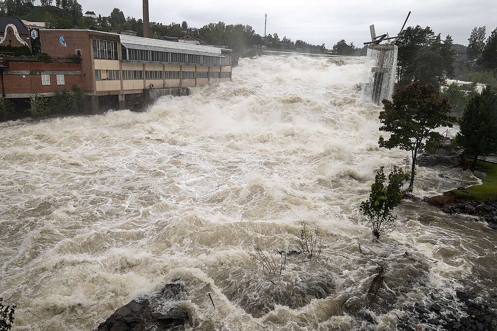 Engorged rivers and waterways have resulted in abnormally high water levels at the waterfall in the centre of Hønefoss, causing local damage to property and infrastructure.. Local storm 'Hans' has resulted in extremely high water levels, flooding and damage throughout the south of Norway. © Johanna Hanno / Greenpeace