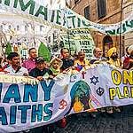 A climate change march with interfaith participants in Vatican City in 2015.