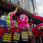 Greenpeace activists crash Deep Sea Mining Summit in London with a giant octopus to show wherever the deep sea mining industry goes, they’ll be there to stop them.