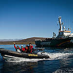 Former mayor of Clyde River, Jerry Natanine (L), 3rd Mate of the Arctic Sunrise, Ignacio Soaje, resident of Clyde River, Clara Natanine, Medic of the Arctic Sunrise, Valeriy Kharchenko and Mayor of Clyde River, James Qillaq take a RHIB to Clyde River from the Arctic Sunrise.
The ship has come to Clyde River, Nunavut, to deliver solar panels for the community.