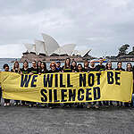 As part of a Global Week of Action, Greenpeace Australia Pacific activists show the widespread solidarity of the global Greenpeace network to send the message to Energy Transfer: “We will not be silenced”. 

After being moved on by the police several times around the Sydney Opera House, the group finally negotiated to take this photo of solidarity, under the watch of 20+ police officers and security guards, before being quickly dispersed.