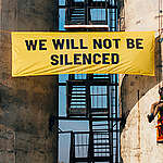 As part of a Global Week of Action, Greenpeace Poland activists show the widespread solidarity of the global Greenpeace network to send the message to Energy Transfer: "We will not be silenced".