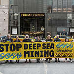 Greenpeace USA activists unfurl a banner calling on the US government to Stop Deep Sea Mining in front of Trump Tower on 5th Avenue in New York City.