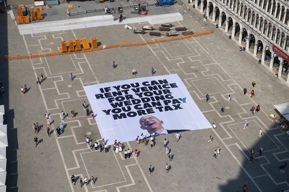 ‘Everyone Hates Elon’ and Greenpeace unfold giant banner on Piazza San Marco ahead of Bezos’ wedding 